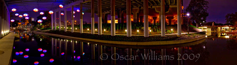 IH 35 Riverwalk Bridge with Donald Lipiski's Sunfish Under the IH 35 bridge at night with the Sunfish by Donald Lipiski illuminated.